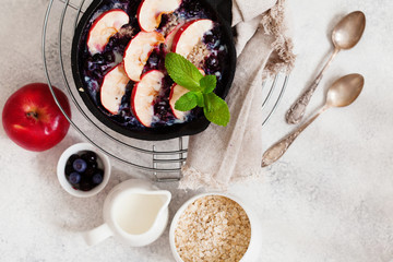 Breakfast baked oatmeal with apples, blueberries and chia seeds, from above