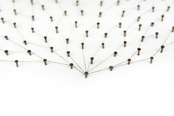 Linking entities.social media, internet communication abstract. a small network connected to a larger network. in paper linked together with copy space by cotton with a black tint