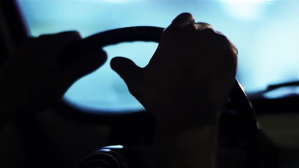Hands Holding The Steering Wheel of a Vintage Car