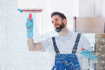 Janitor Cleaning Window With Squeegee