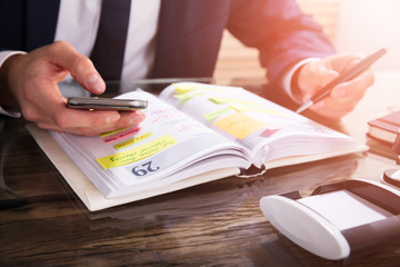 Businessperson Using Mobile Phone