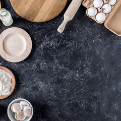 flay lay with arranged bread bakery ingredients and kitchenware on marble tabletop