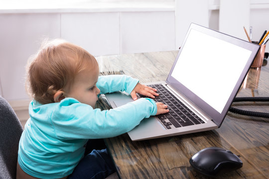 Baby Girl Using Laptop