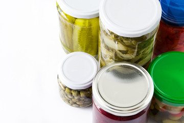 Fermented preserved vegetables in jar isolated on white background