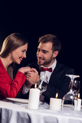 beautiful smiling couple spending time on romantic date in restaurant