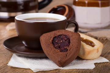 Chocolate and Vanilla Hamantash Cookies and Cup of Coffee