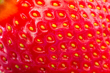 Extreme macro of red strawberry texture for background