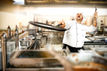 Cook chef in kitchen 