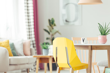 Yellow designer chair in interior