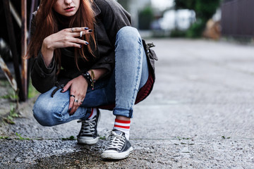 Young girl smoking cigarette