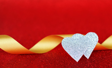 Two hearts love silver on red background
Valentine's Day Concept