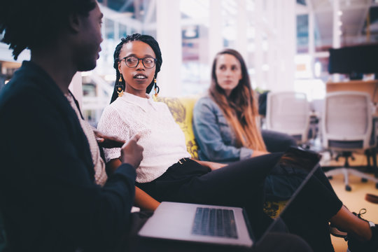 Group of young adults having a meeting in the office