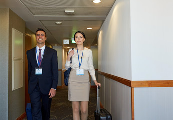 business team with travel bags at hotel corridor