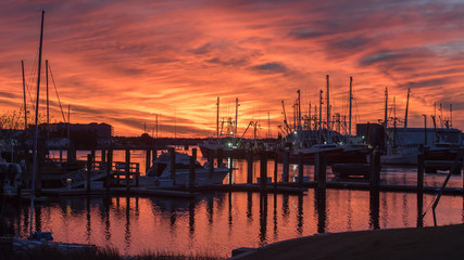 Fototapeta na wymiar Fishing boats at sunset in Marina