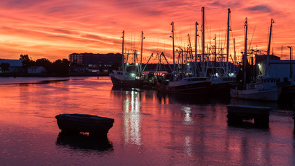 Fishing boats at sunset in Marina at the Coast of North Carolina