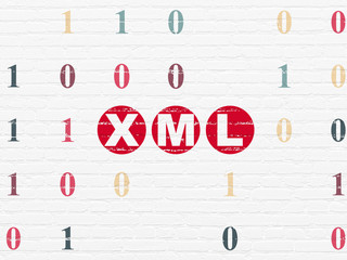 Programming concept: Painted red text Xml on White Brick wall background with Binary Code