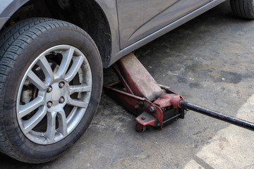 Repairing car with lifting up in shop