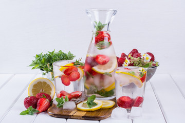 Fruit and herb infused water. Cold refreshing vitamin detox water. Summer drink