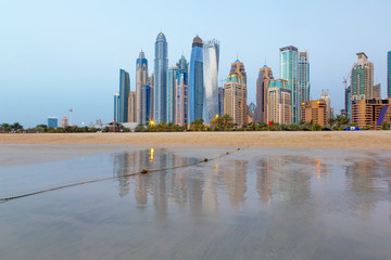 Dubai - The Marina towers from beach in evening light.