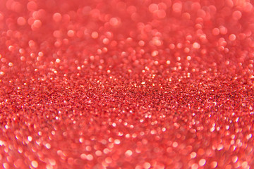 Red glitter defocused texture background. Red christmas abstract background