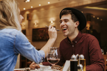 Young Woman Feeding Hew Boyfriend