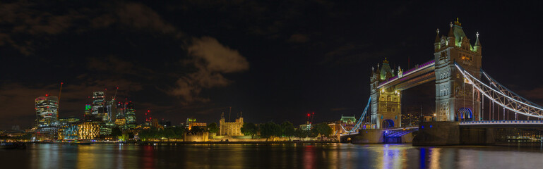 Fototapeta na wymiar London - The nightly panorama with the Tower bridge, Tower and skyscrapers of financial discrict.