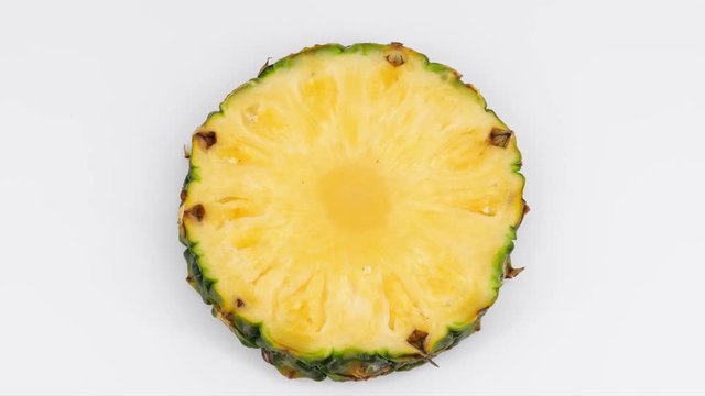 Pineapple section rotating (loopable), top view, 4K 