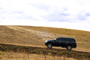 SUV on the hill
