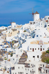 Santorini - The look to part of Oia with the windmills.