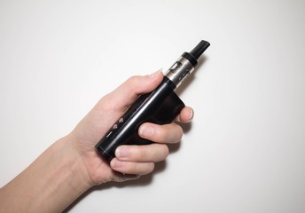 vape, electronic cigarette in hand on white background