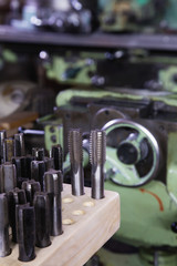 Various threads and tools for milling machine in a smith workshop