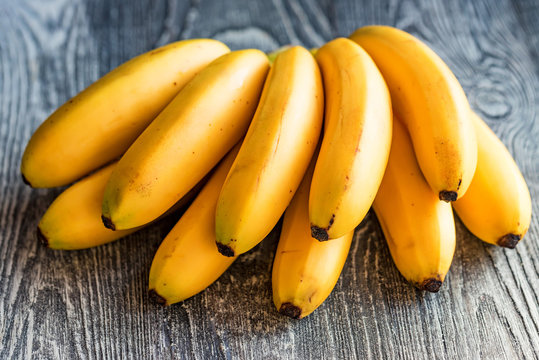 Bunch of bananas on wooden background