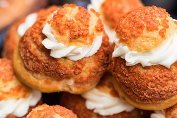 Close up fresh buns with cream on top
