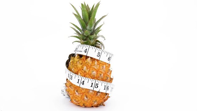 Pineapple rotating on white background, (loopable video) 4K UHD