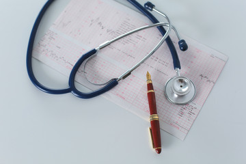 docter workplace with a stethoscope Cardiogram chart with medical table closeup,for heart record