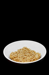 Isolated Instant Noodles in White ceramic bowl on Black background with clipping path