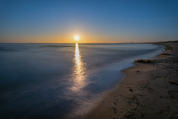 Colorful sunrise over the sea. Nature composition. Concept: weather or travel