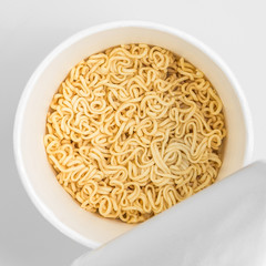 Top view of Isolated Instant Noodles in paper cup on white background with clipping path