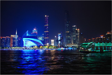 Fototapeta na wymiar View of Canton metropolis from embankment illuminated at night, China