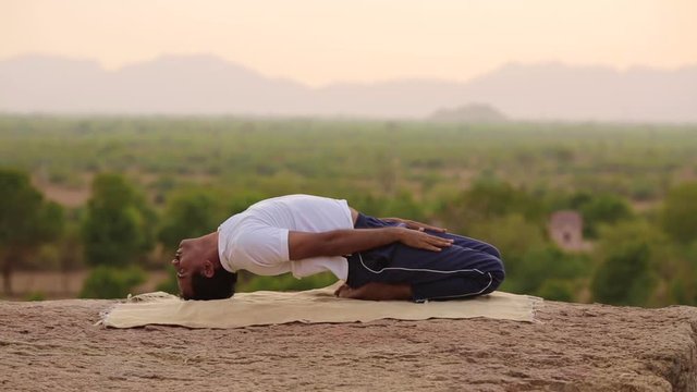 Young Man In Yoga Pose
