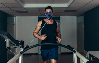 Runner testing his performance in sports science laboratory
