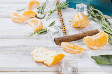 Fototapeta na wymiar cocktail with tangerines, juice and ice