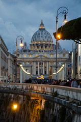Rome, Italy. View of the san Peter's basilica at the sunset of an evening during christhmas period. View from s.Angelo's bridge.