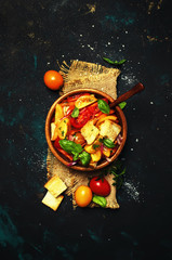 Fototapeta na wymiar Salad With Tomatoes, Basil And Stale Bread, Rustic Style, Top view