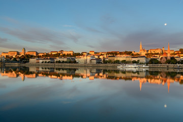 Buda side of Budapest city reflecting in still river