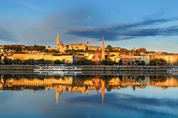 Buda side of Budapest city reflecting in still river
