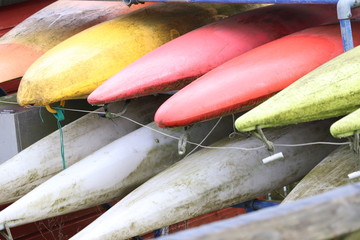 Canoes  stacked up ready for action  multi colours 