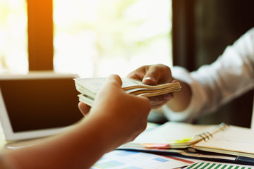 Businessmen are paying compensation to partners.