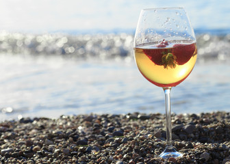 Frozen strawberry sangria cocktail at the edge of the sea.