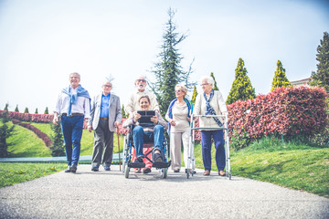 Senior people walking outdoors